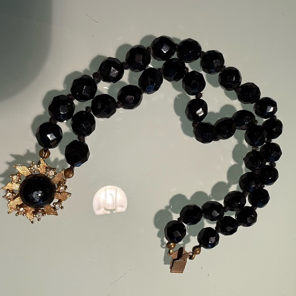 Vintage double strand bracelet, black beads gold flower closure